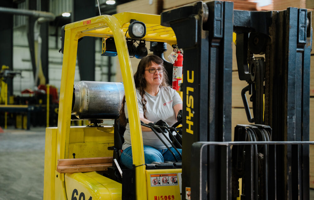 female forklift operator Freres warehouse